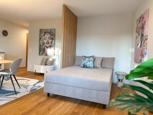 Posezení v ubytování "THREE" - Premium Apartments Seekirchen, modern, zentral gelegen