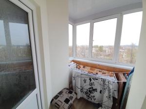 a room with two windows at Apartment in The Heart of the Capital in Chişinău