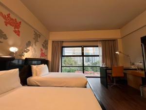 Postel nebo postele na pokoji v ubytování Hotel Maya Kuala Lumpur City Centre