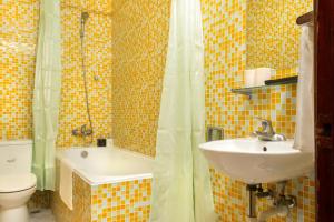 a bathroom with a sink and a toilet and a tub at Hanoi Bliss Mai Hac De in Hanoi +75 photos