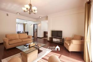 a living room with two couches and a tv at Elegant Edge 3BHK Apartment in Pātan