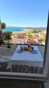 a table on a balcony with a view of the ocean at Estudio vistas al mar y a 5 minutos playa Estartit in L'Estartit