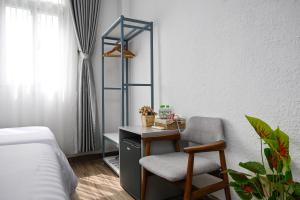 Postel nebo postele na pokoji v ubytování Amory Hotel Saigon Center