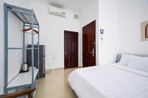 Postel nebo postele na pokoji v ubytování Amory Hotel Saigon Center