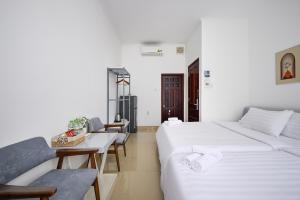 Postel nebo postele na pokoji v ubytování Amory Hotel Saigon Center