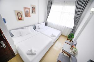 Postel nebo postele na pokoji v ubytování Amory Hotel Saigon Center
