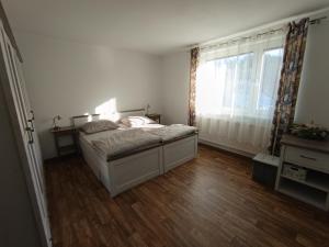 Postel nebo postele na pokoji v ubytování Apartmány Jablunkov