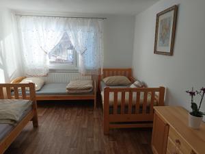 Postel nebo postele na pokoji v ubytování Apartmány Jablunkov