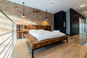 Posteľ alebo postele v izbe v ubytovaní Qbik Loft Aparts