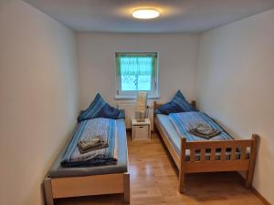 Postel nebo postele na pokoji v ubytování Ferienhaus Alfenz