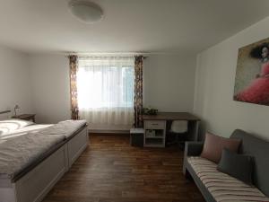 Postel nebo postele na pokoji v ubytování Apartmány Jablunkov