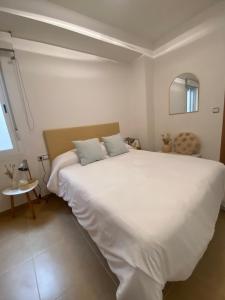 a bedroom with a large white bed in a room at Bajo en Pliego - Tranquillity and Natural Beauty in Pliego