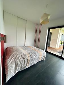 Un ou plusieurs lits dans un hébergement de l'établissement Villa De L'Amiral - LUXE ET DETENTE A POMMEVIC