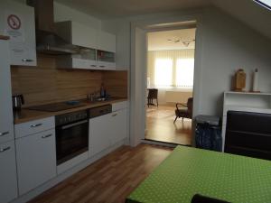 Kuchyň nebo kuchyňský kout v ubytování Venner Gasthaus