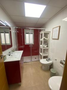 a bathroom with a sink and a shower and a toilet at Bajo en Pliego - Tranquillity and Natural Beauty in Pliego