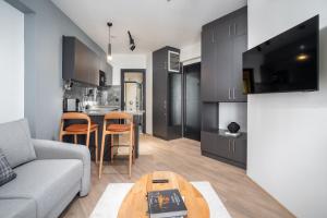 a living room with a couch and a table at Urban Quarters - Firuzağa in Istanbul