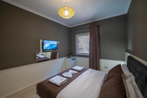 Postel nebo postele na pokoji v ubytování Hotel Aria