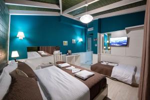 Postel nebo postele na pokoji v ubytování Hotel Aria
