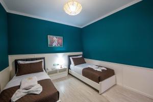 Postel nebo postele na pokoji v ubytování Hotel Aria