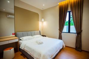 Ένα ή περισσότερα κρεβάτια σε δωμάτιο στο Ipoh Modern Luxury House 4B3B 14 pax
