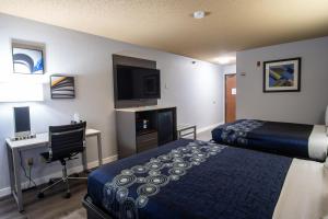 Postel nebo postele na pokoji v ubytování Coratel Inn and Suites By Jasper Eagan ST Paul Airport & Mall of America