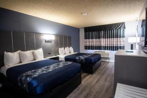 Postel nebo postele na pokoji v ubytování Coratel Inn and Suites By Jasper Eagan ST Paul Airport & Mall of America