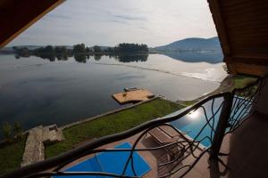 a view of a lake from the balcony of a house at House Sablja in Ogulin