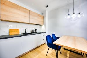 Kuchyň nebo kuchyňský kout v ubytování ReVital Mechelinki by Homeprime Parking Free