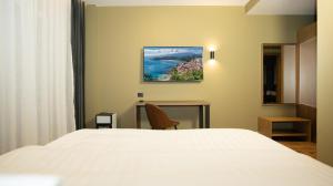 A bed or beds in a room at Porta e Alpeve