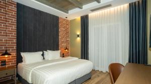 A bed or beds in a room at Porta e Alpeve