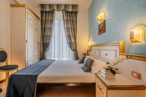 Postel nebo postele na pokoji v ubytování Hotel King