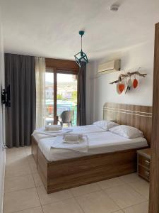 Postel nebo postele na pokoji v ubytování Foça Mint Hotel