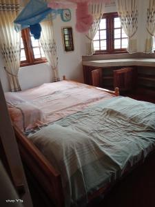 A bed or beds in a room at Sapugolla Family Resort