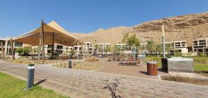 a bike parked on a sidewalk in front of a building at ONE Guest Place Elegant 1BHK Apartment in Muscat Bay 01 in Muscat