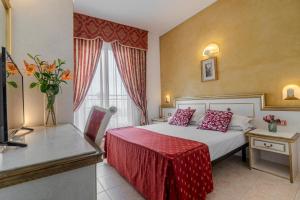 Postel nebo postele na pokoji v ubytování Hotel King