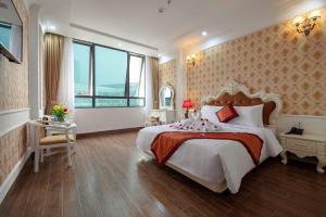Ένα ή περισσότερα κρεβάτια σε δωμάτιο στο Busan Hotel