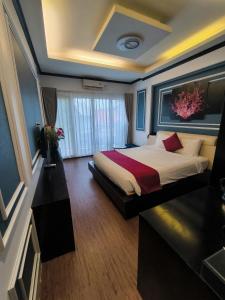Voodi või voodid majutusasutuse Eclipse Legend Hotel toas