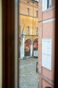 a view of a street from a window at LHE Black Rose in Cesena
