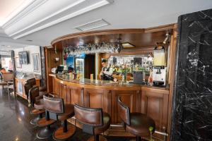 a bar with a man standing behind it at The Green Park Taksim in Istanbul