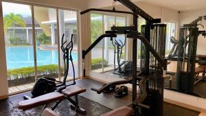 The fitness centre and/or fitness facilities at Stylish home with amazing pool views