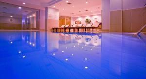 a swimming pool in a hotel room with a pool at The Green Park Taksim in Istanbul