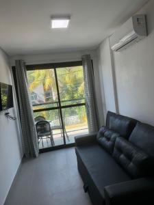 Χώρος καθιστικού στο Flat Beira Mar Maracaípe- Porto de Galinhas