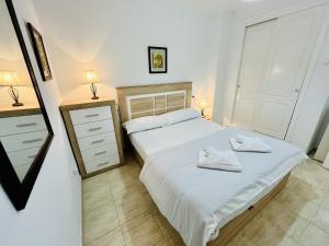 A bed or beds in a room at A2 - Calasol - 2004 Finestrat