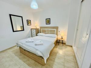 A bed or beds in a room at A2 - Calasol - 2004 Finestrat