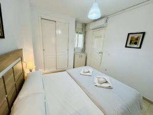 A bed or beds in a room at A2 - Calasol - 2004 Finestrat
