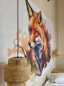 a painting of a fox on a wall at High Five Villas in Pamporovo