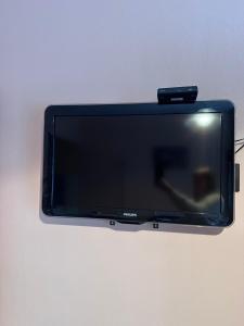 a flat screen tv hanging on a wall at Appartement Le Palais in Vernet-les-Bains