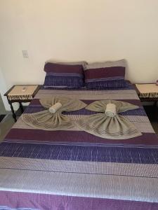 Ένα ή περισσότερα κρεβάτια σε δωμάτιο στο Chalé do galo