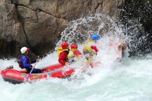 a group of people in a raft in the water at Murchison Motels in Murchison