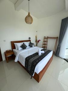 Postel nebo postele na pokoji v ubytování TUGU Bali glamping